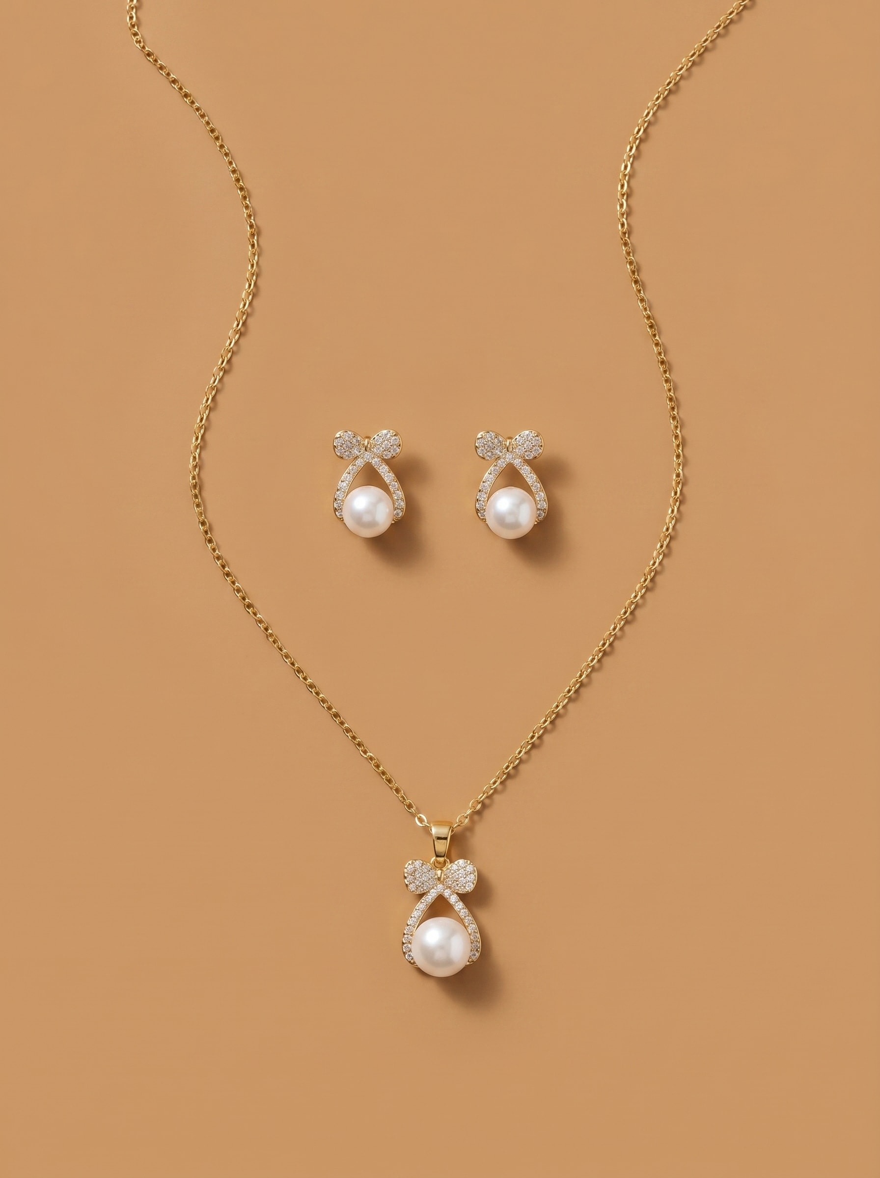 Pearl Bow Pendant Set with Matching Earring Studs - Image 1